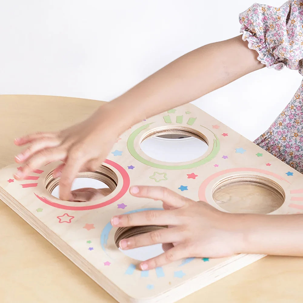 Child developing skills with an Eduplay sensory board